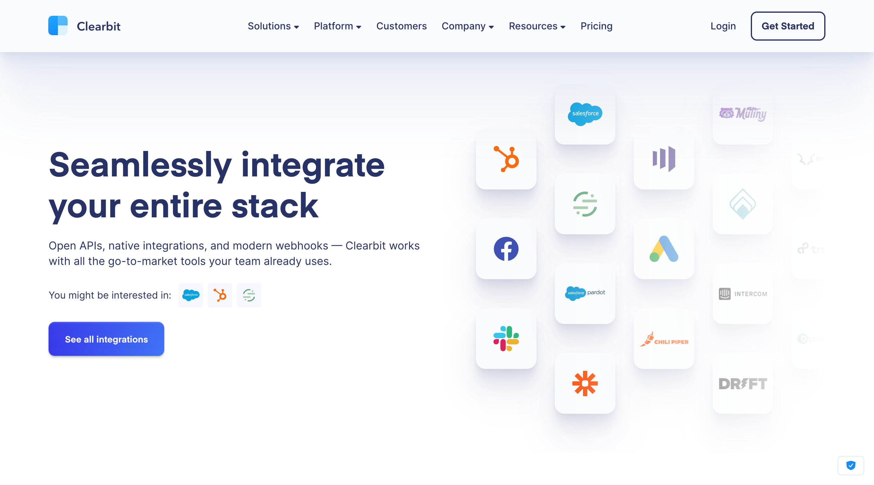 Screenshot of the 'Seamlessly integrate your entire stack' section of the Clearbit website. A header contains the logo, the primary site navigation, and calls-to-action to 'Login' or 'Get Started'. The left side of the page contains a short paragraph and a 'See all integrations' call-to-action. On the right is an assortment of third-party company logos representing the integrations that Clearbit provide.